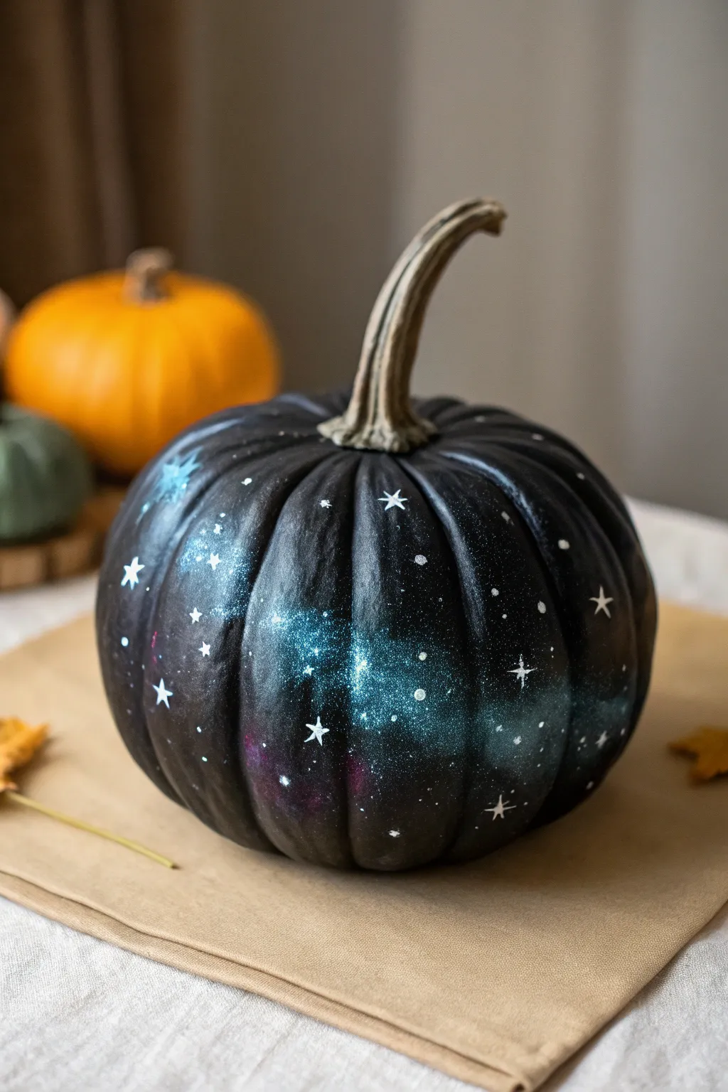 DIY galaxy pumpkin with dreamy nebula swirls and starry speckles for cozy fall nights