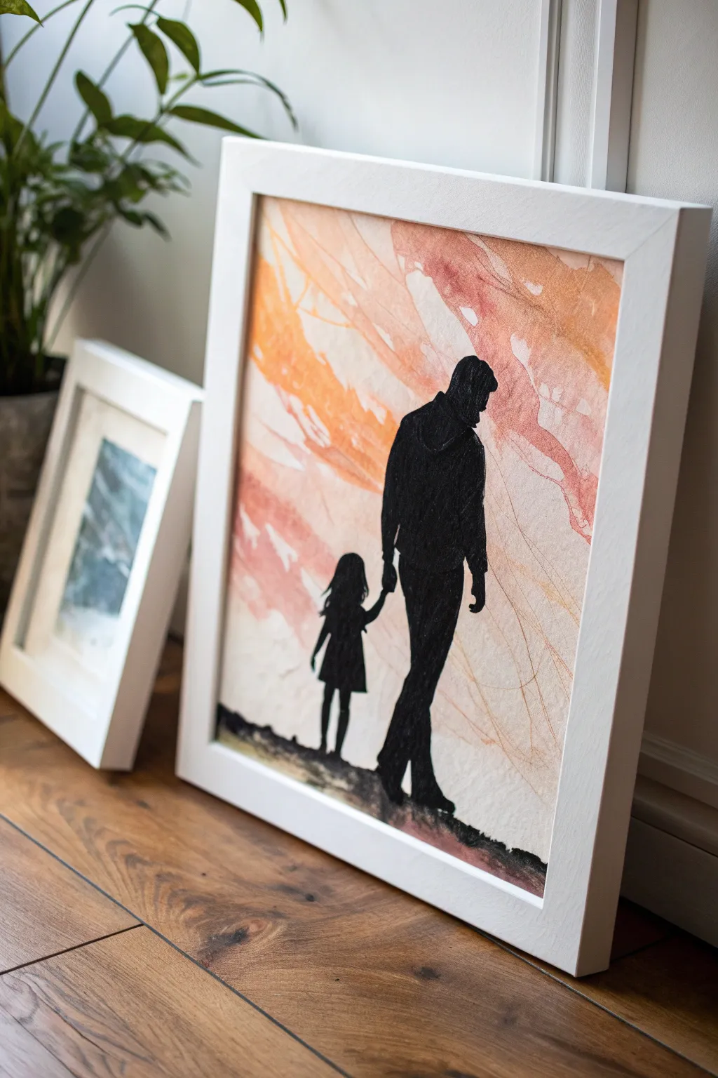 Bold abstract acrylic background with a crisp father-daughter silhouette cutout, modern and heartfelt