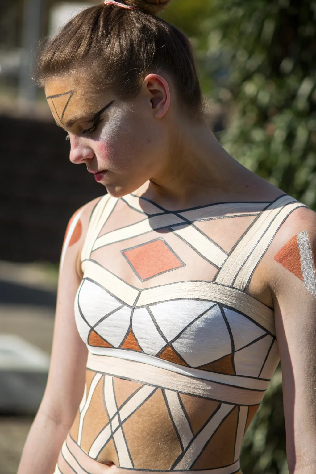 Minimalist 3D cubes and ribbon bands on a torso, with crisp highlights and deep shadows