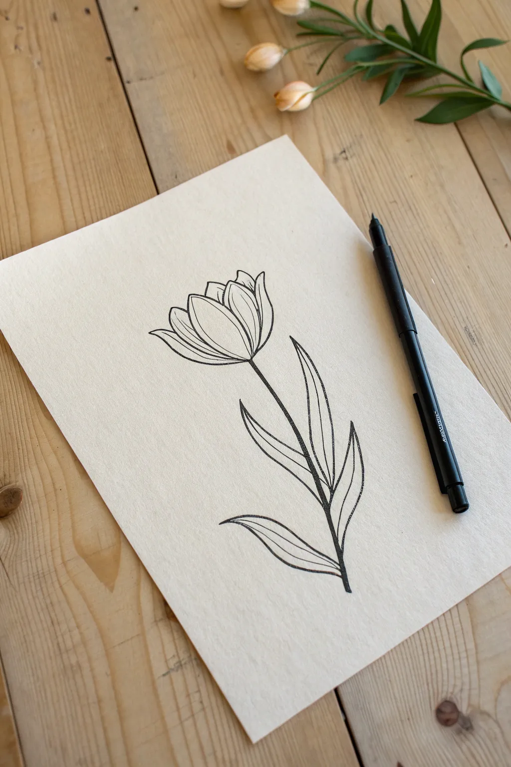 Capture natural beauty with a single stroke using this continuous line floral art style.