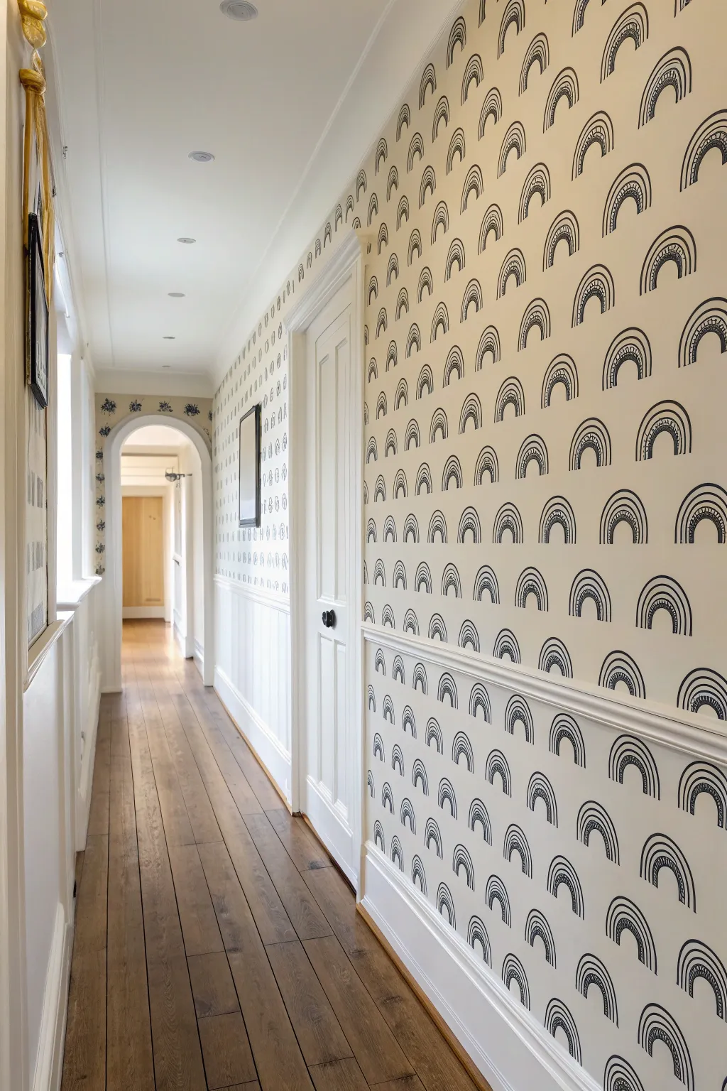 Tiny hand-painted repeats turn a simple hallway into a bold, modern wall paint moment.