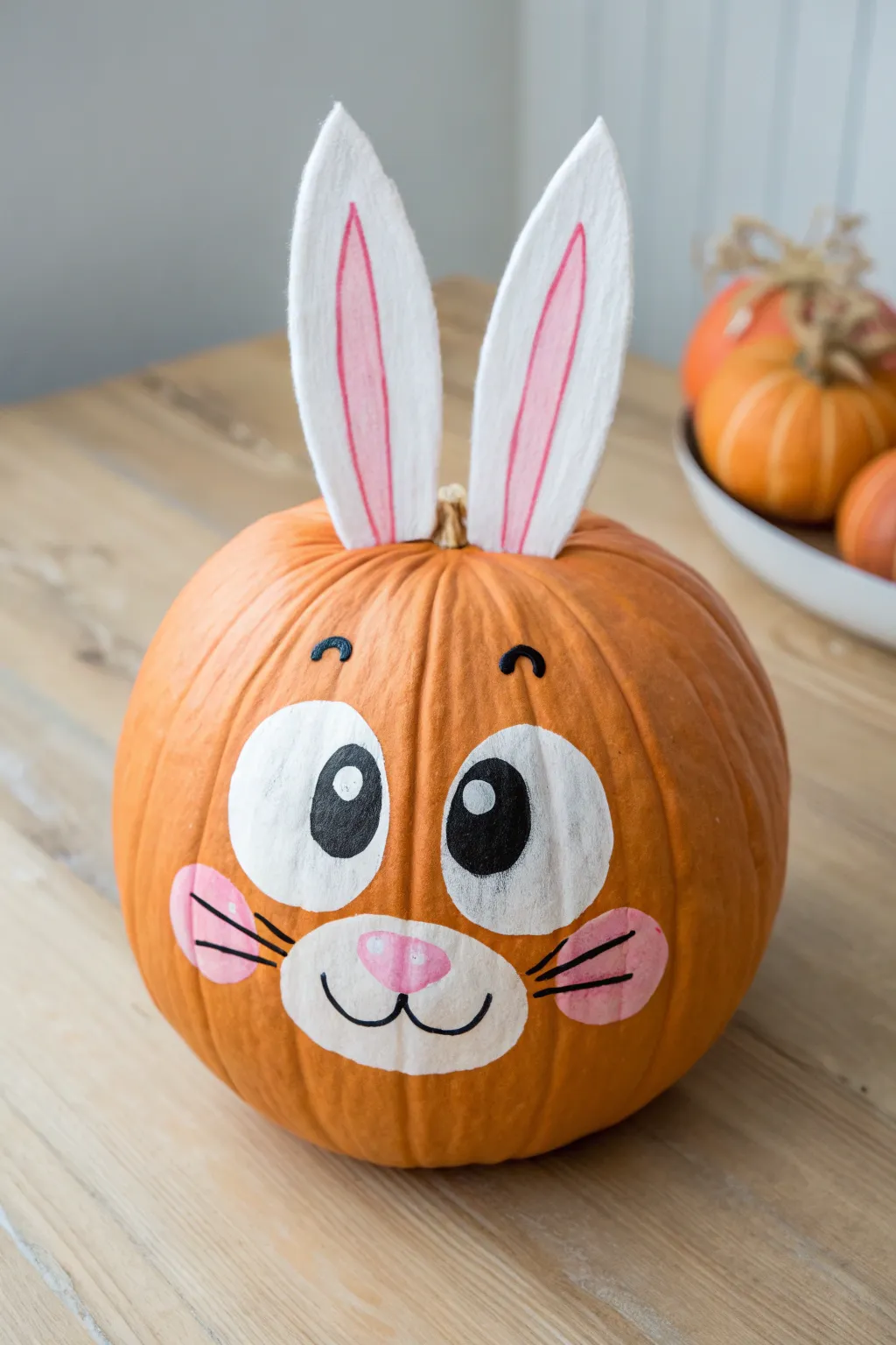 Goofy-cute bunny pumpkin with felt ears, perfect for a minimalist yet boho fall craft