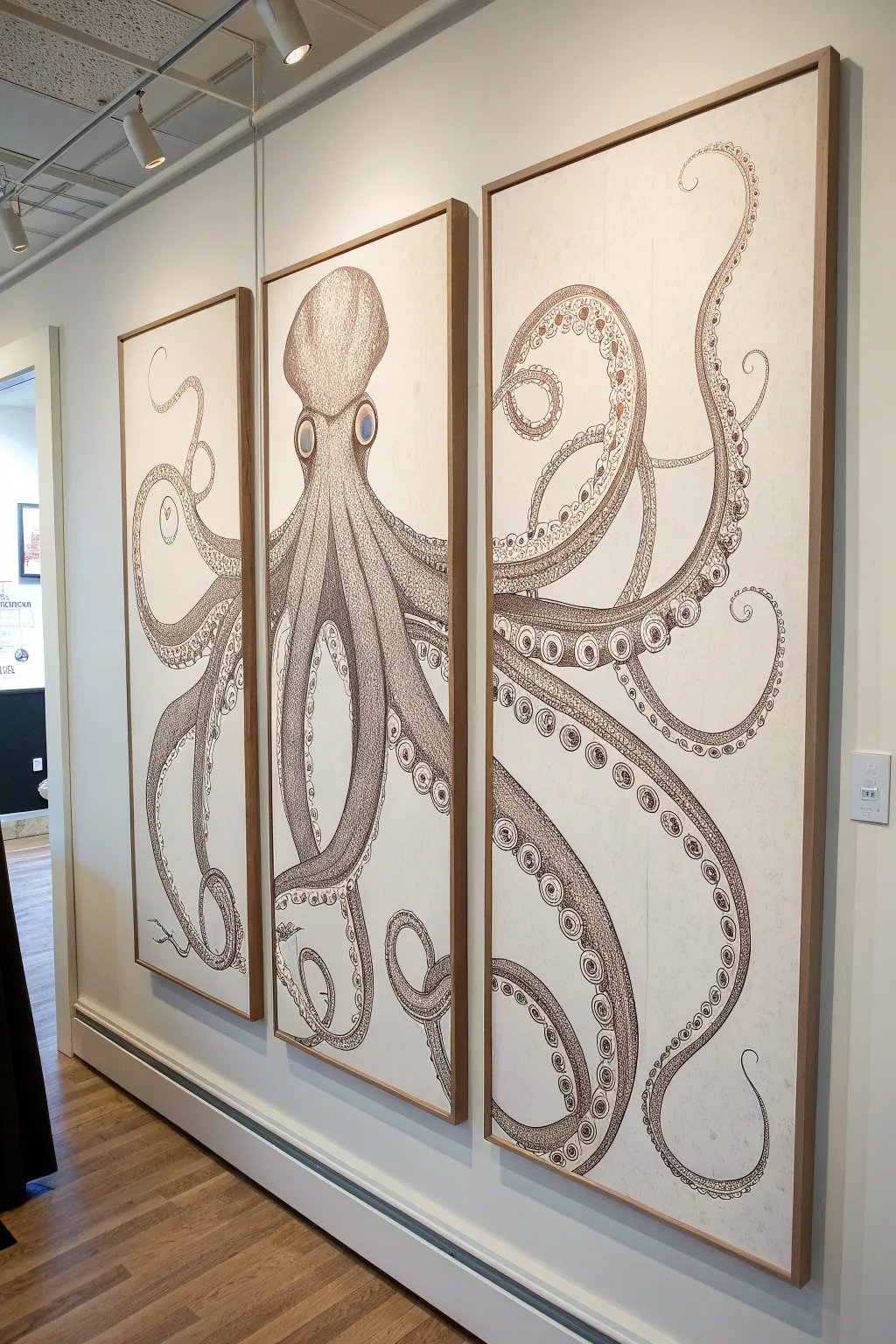 Minimalist octopus triptych with flowing tentacles, soft boho tones and crisp contrast.