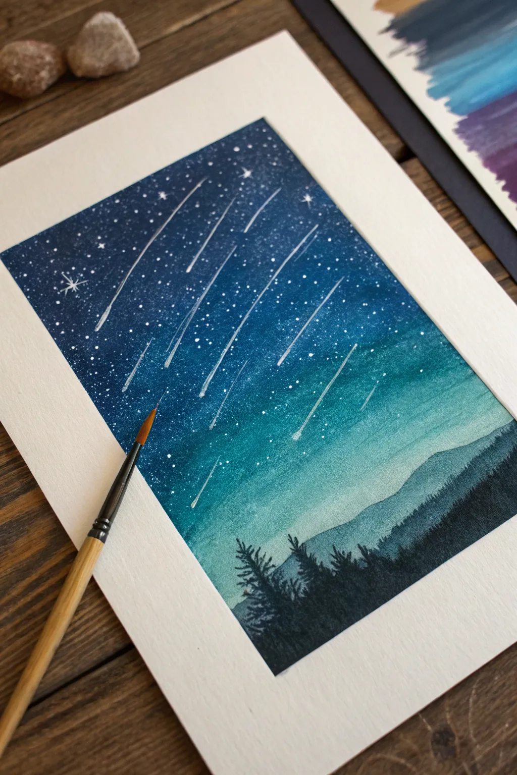 Oil pastel sgraffito starry sky with crisp scratched stars and comet trails in rich contrast