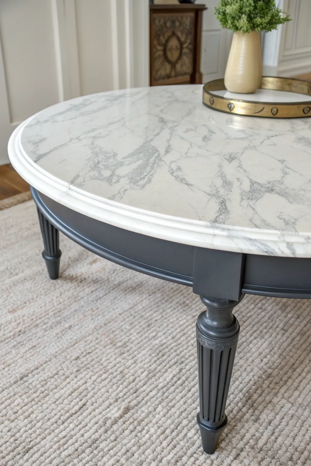 Faux marble coffee table top with a glossy sealant brings minimalist, high end drama at home
