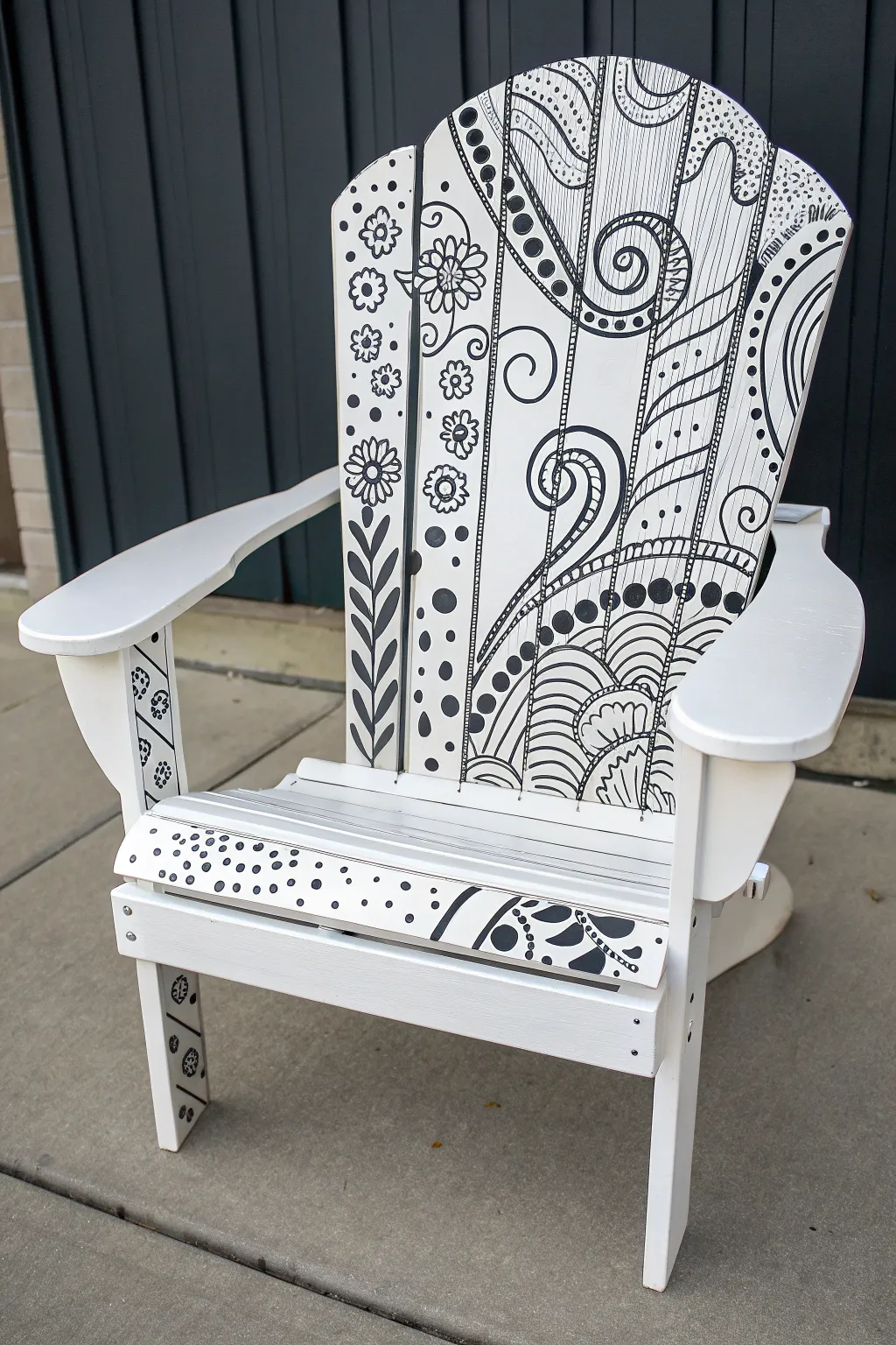 Bold black-and-white doodle Adirondack chair that pops against a clean minimalist backdrop.