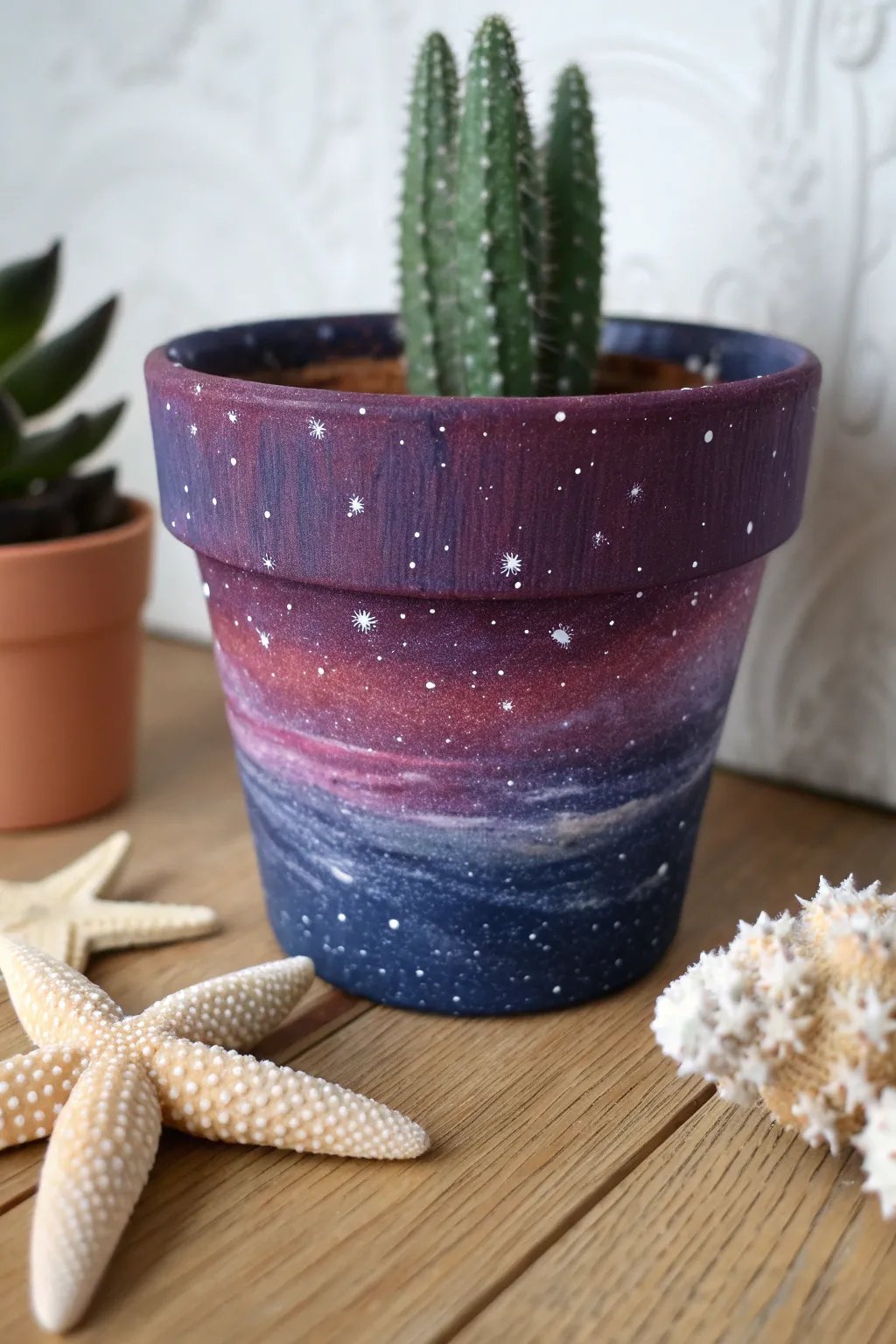 Galaxy swirl plant pot with layered sponging, deep purples and blues, starry speckles