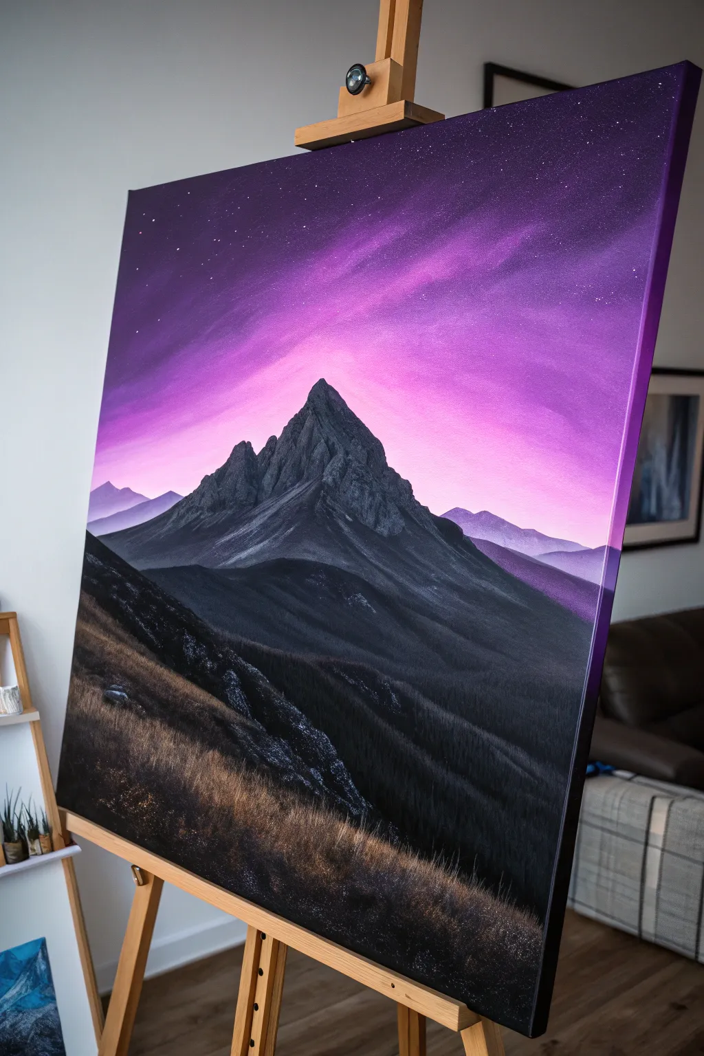 Paint a moody night scene with an electric violet halo glowing behind dark mountain silhouettes