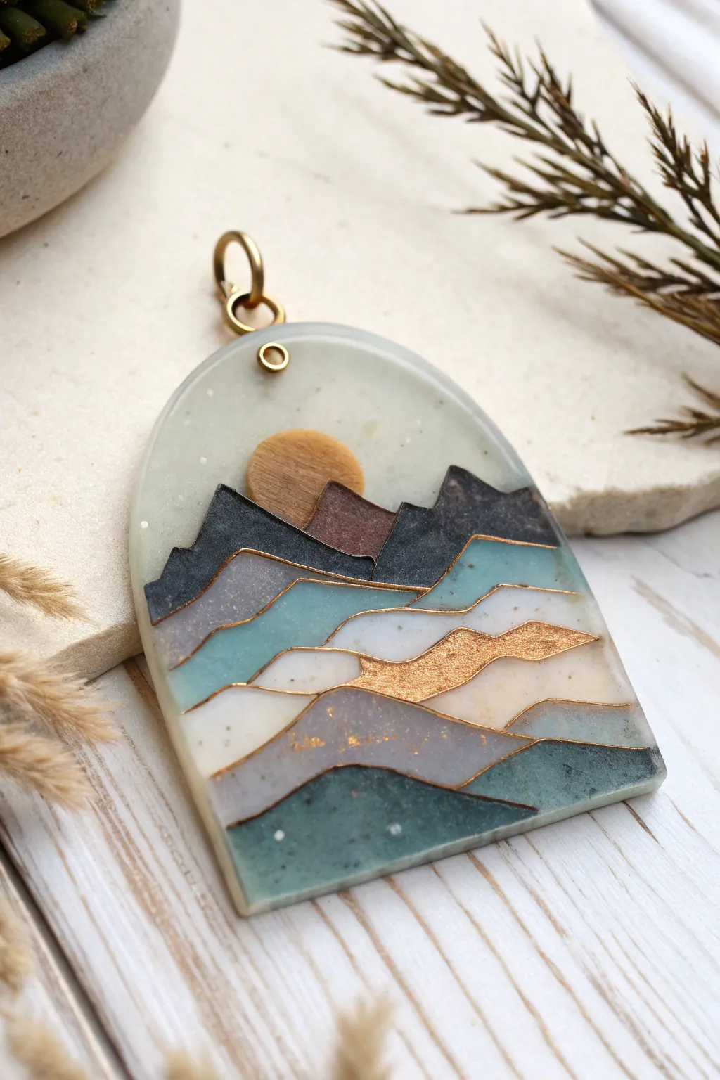 Mini mountain range resin pendant with layered silhouettes, minimalist boho tones and crisp contrast.