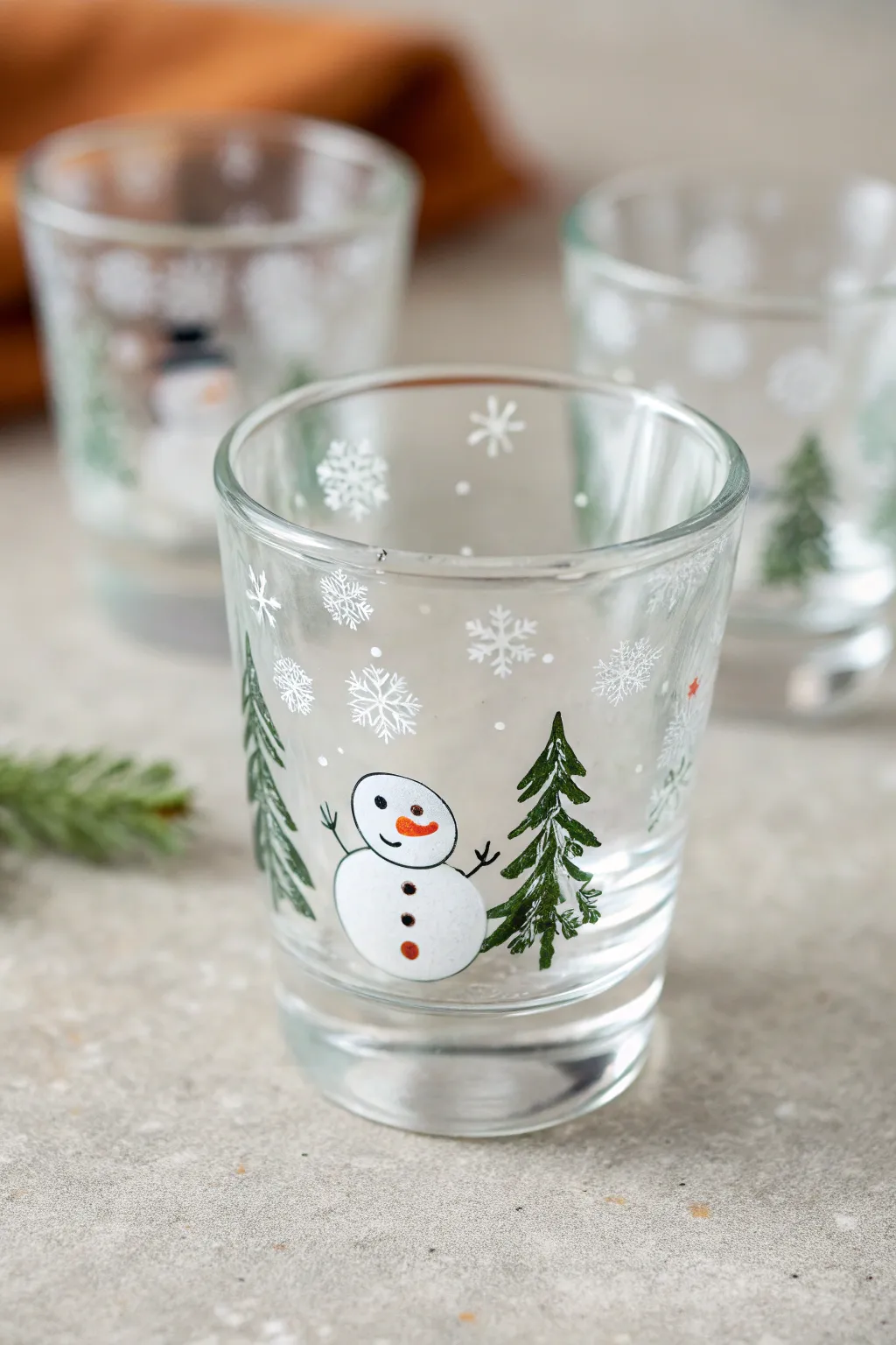 Hand-painted winter shot glass with snowflakes and cozy Scandinavian holiday styling.