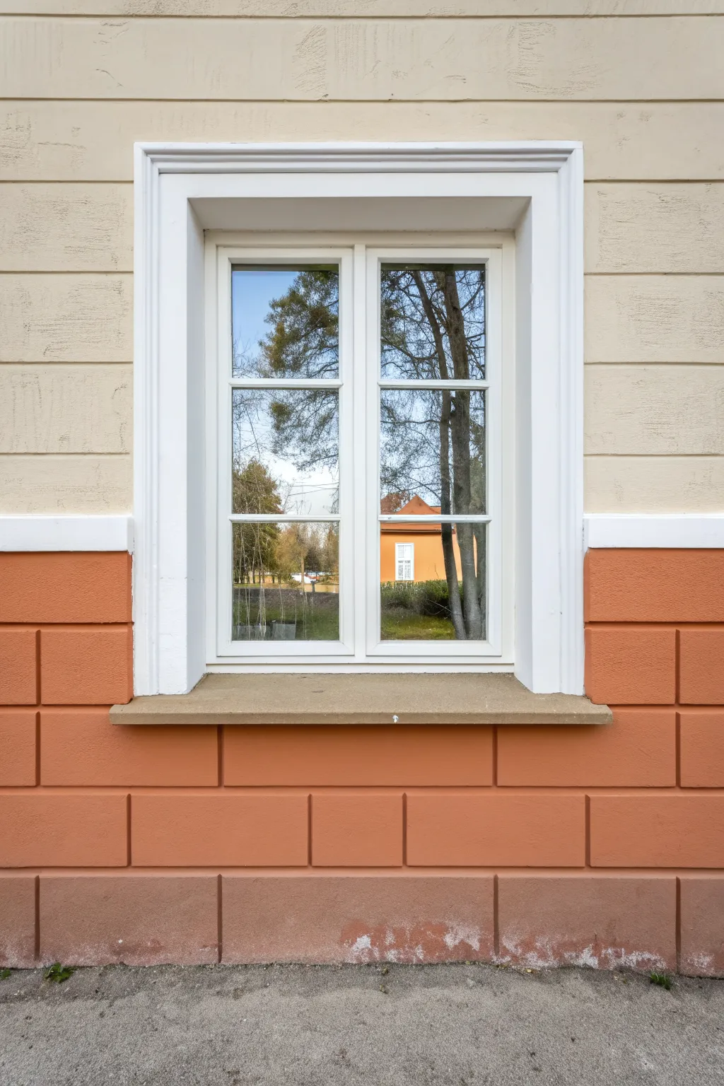 Two-tone wall paint split flowing through the window trim for a clean, cohesive look