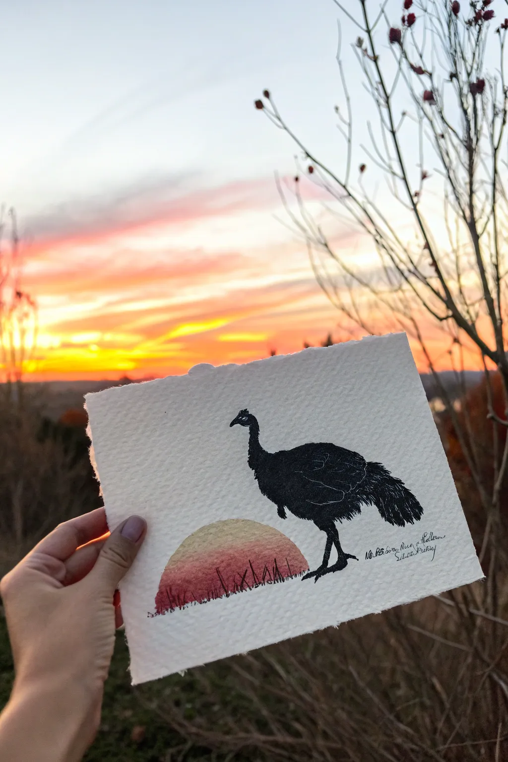 Bold turkey silhouette over a warm finger-painted sunset, an easy Thanksgiving art project