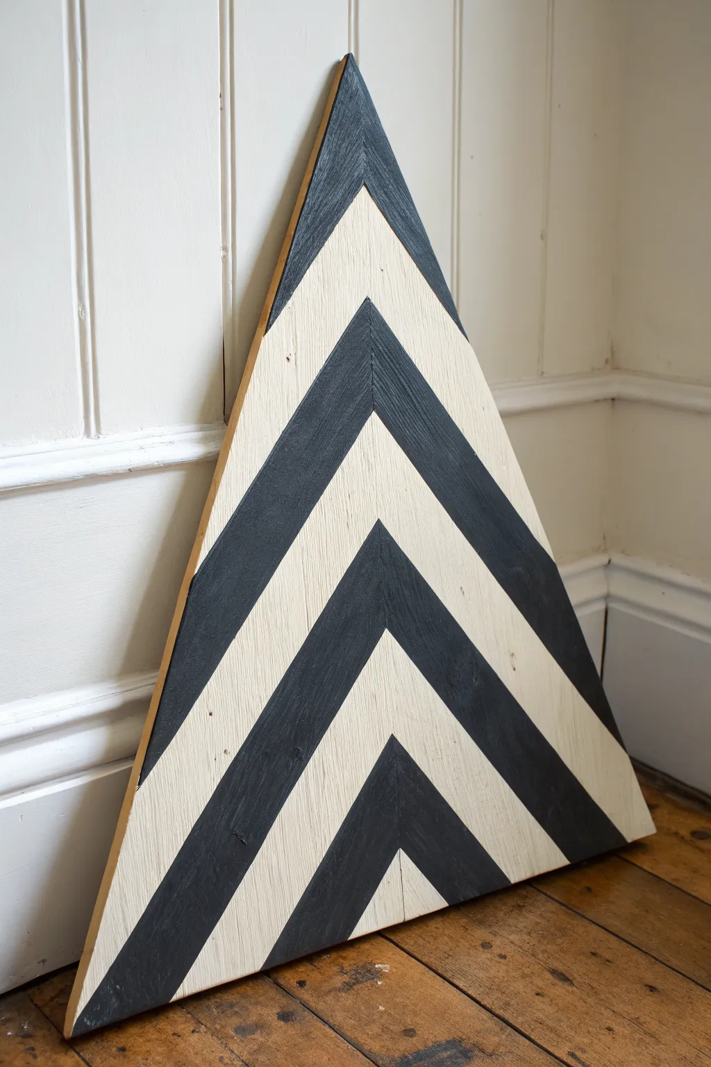 Bold chevron stripes on a triangle canvas for a sleek optical-illusion statement piece