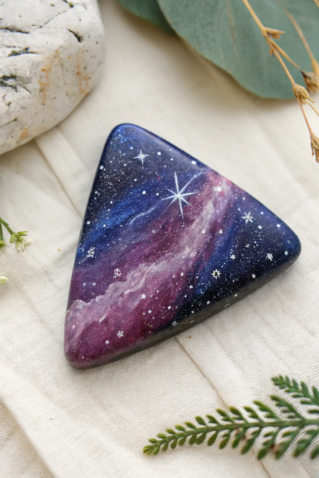 Galaxy sky triangle rock in blended purples and blues, crisp star splatter, minimal backdrop