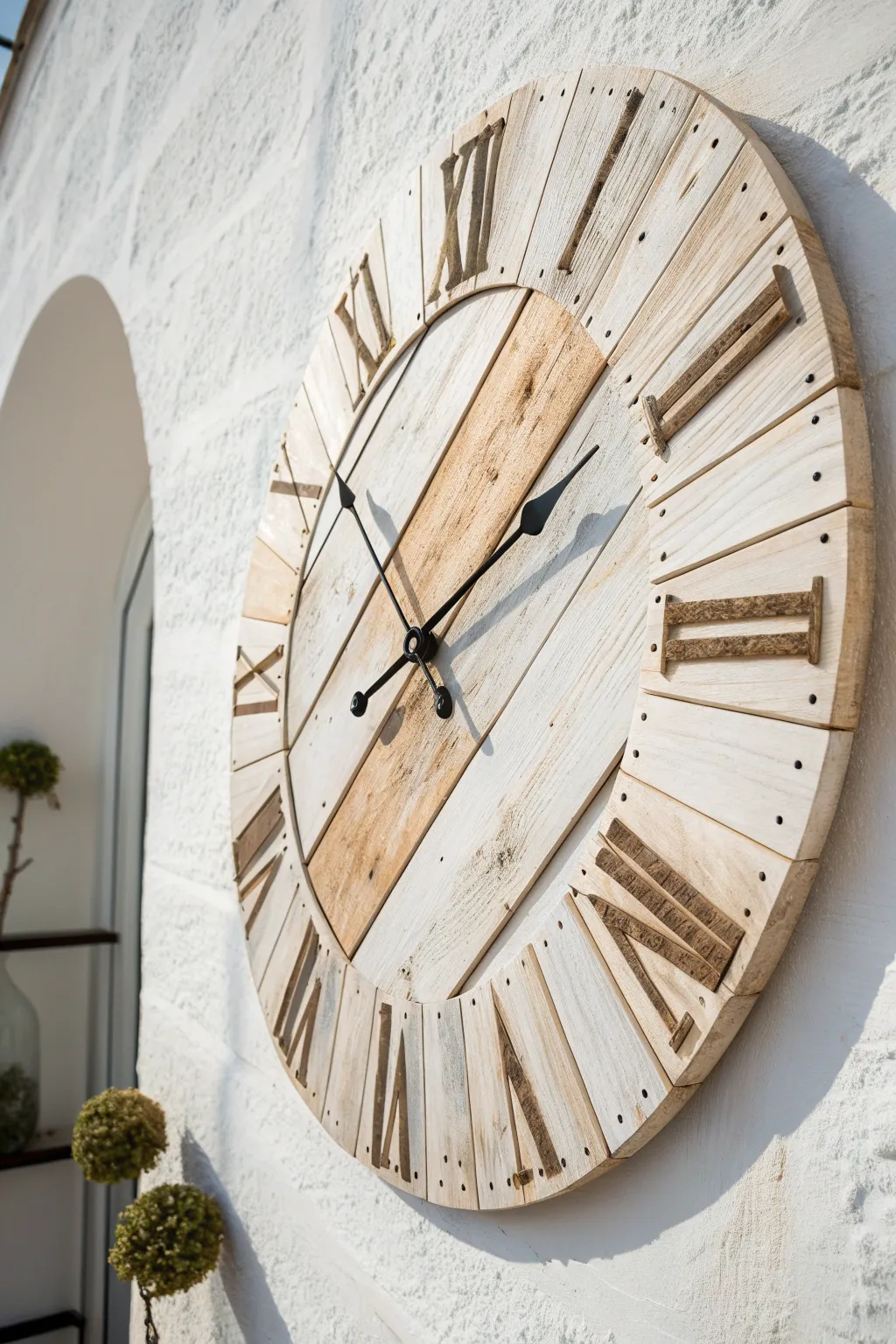 Round pallet-slat clock wall art with soft distressing, minimal styling, and bold contrast