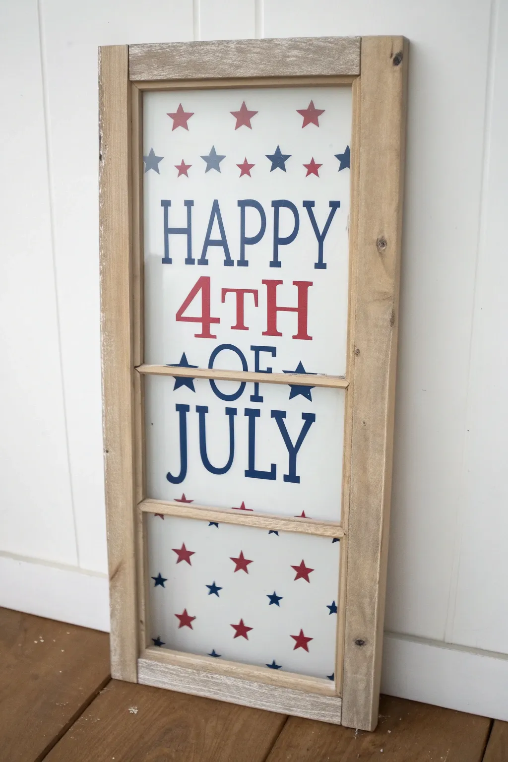 Hand-painted stars-and-stripes lettering for a chic 4th of July window moment today.