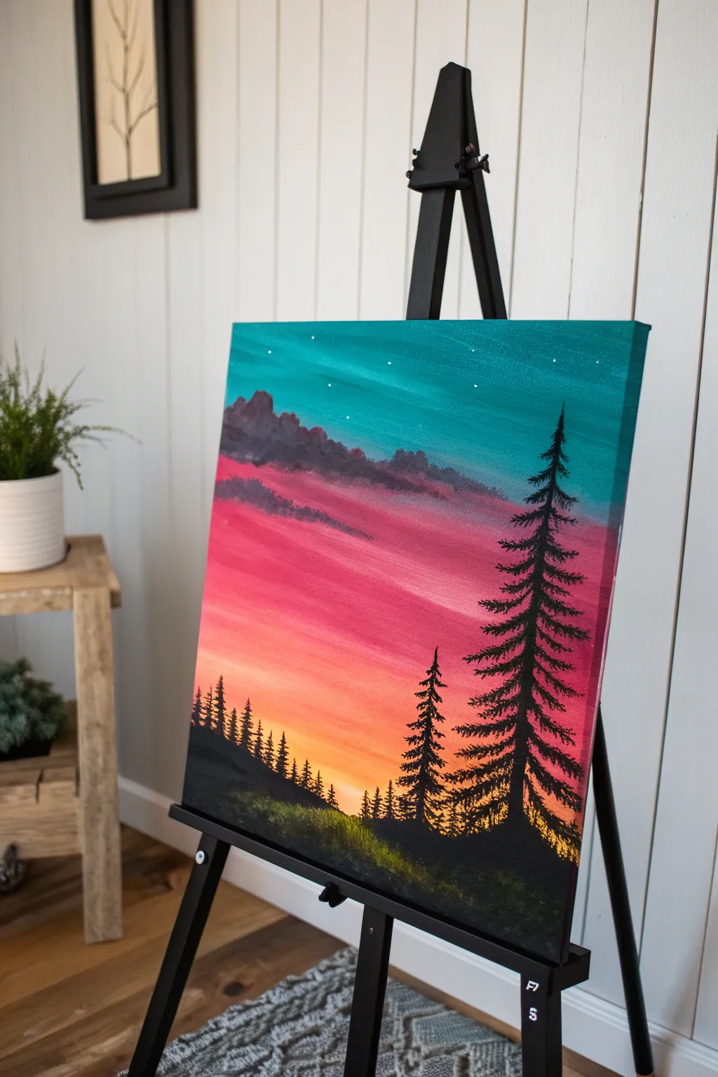 Bold silhouette trees against a glowing sky, a striking minimalist acrylic landscape idea.