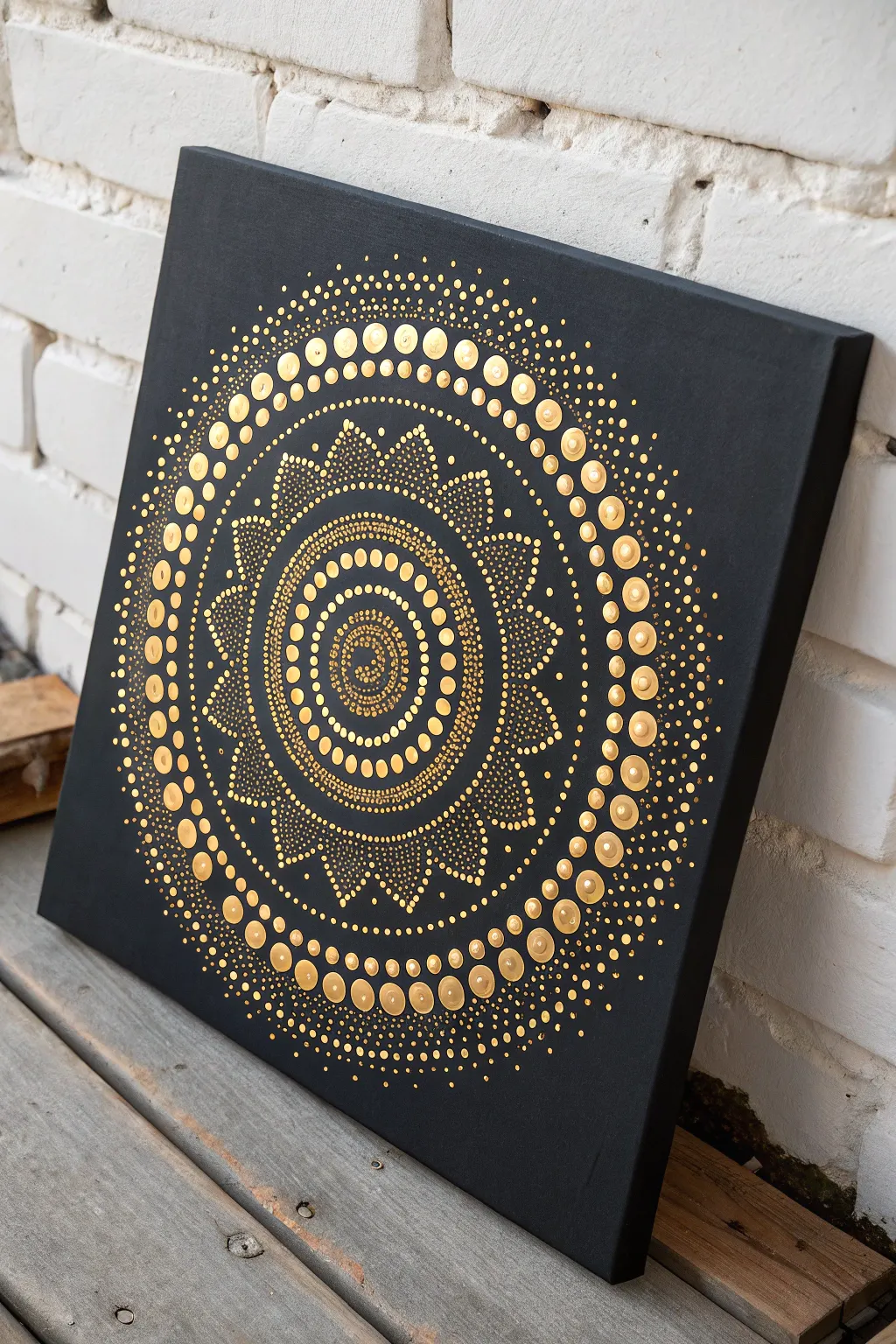 Striking black-and-gold dot mandala on a crisp black canvas, minimal yet bold and luminous