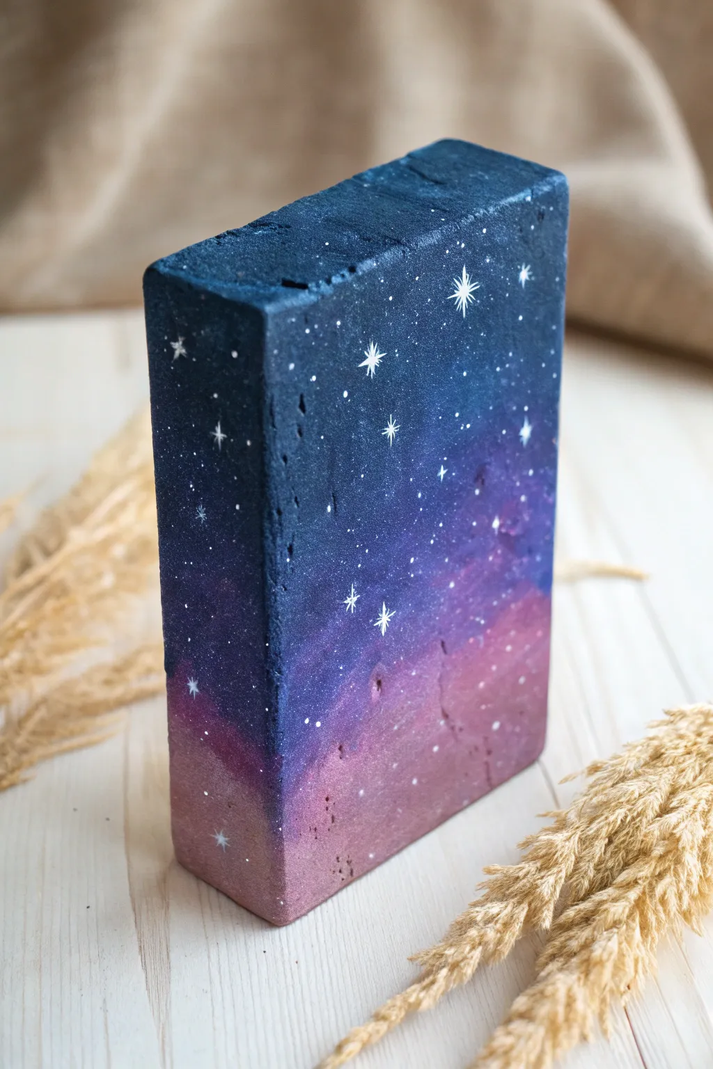 DIY galaxy brick art: deep navy and violet with splatter stars, minimalist boho vibes