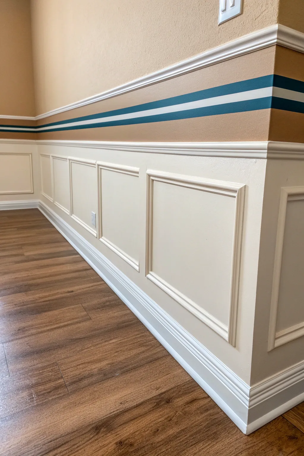 A bold band stripe centered on the chair rail adds instant structure to a calm, minimal wall.