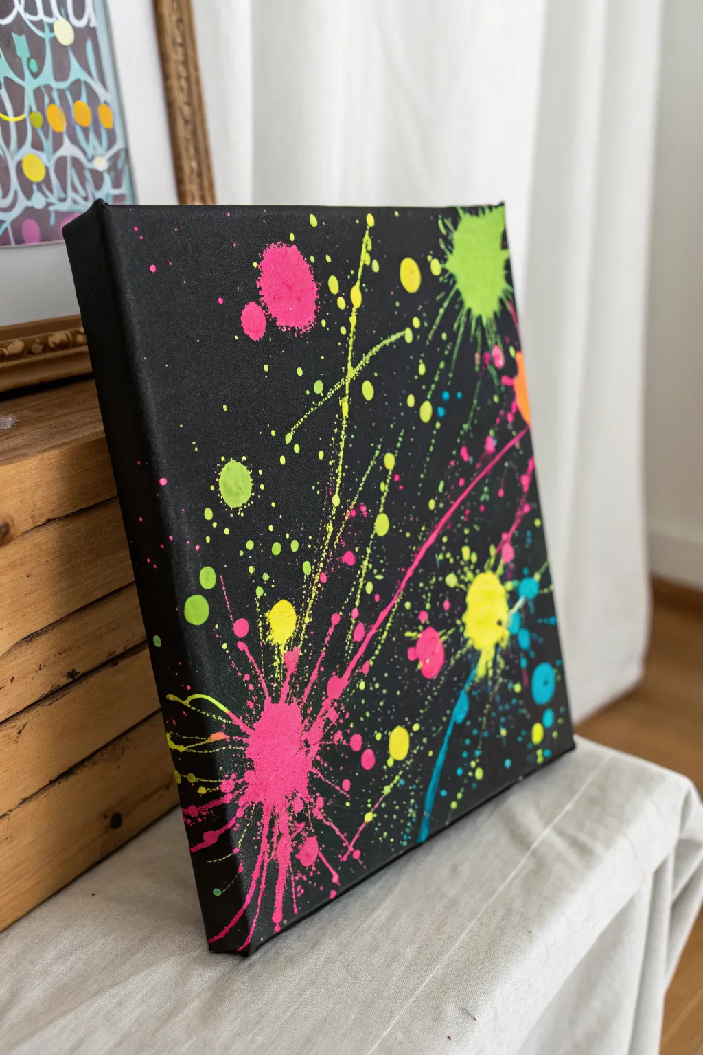 Controlled neon splatter clusters on matte black canvas for bold, modern wall-worthy decor