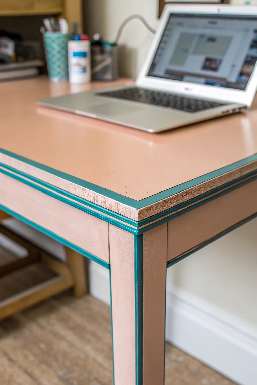 Macro view of a painted desk corner with sleek border lines for an easy DIY framed top.
