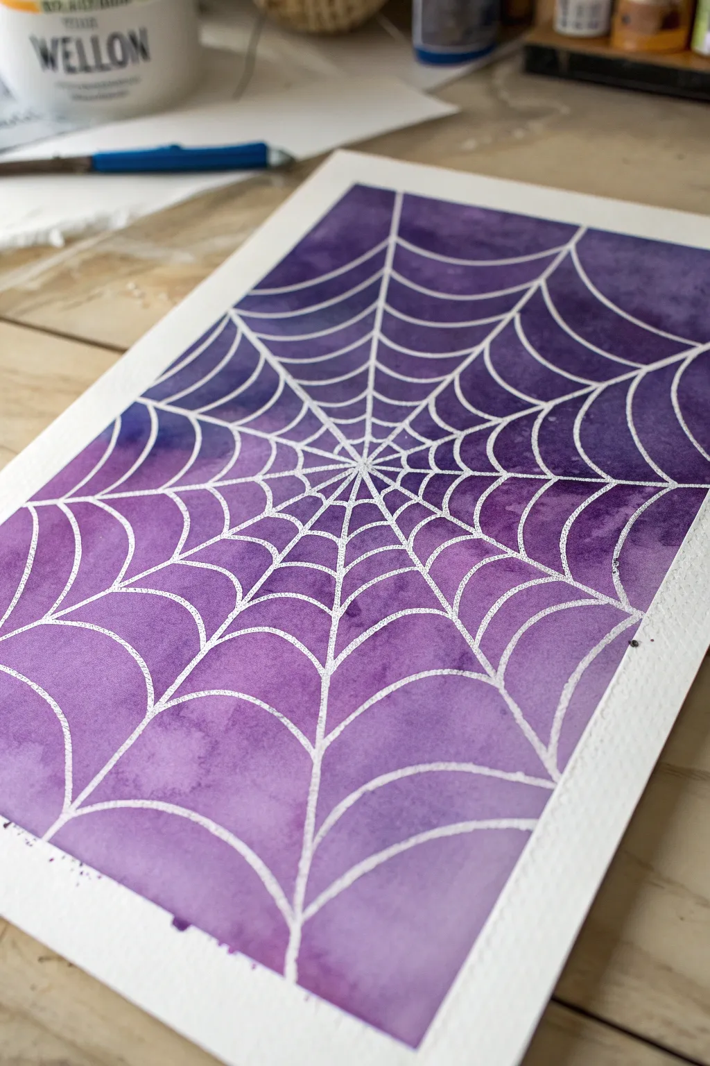 Crisp masking-tape spider web resist with bold purple blend, minimal, graphic, and beginner-friendly.