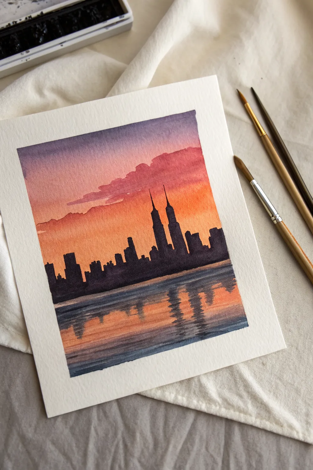 Minimalist watercolor skyline silhouette with warm twilight gradient and simple reflected lights