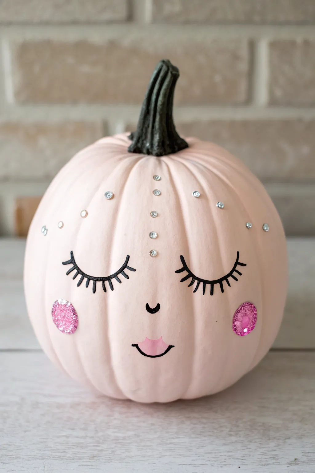 Blush glam girl pumpkin with sparkling rhinestone accents and clean minimalist face