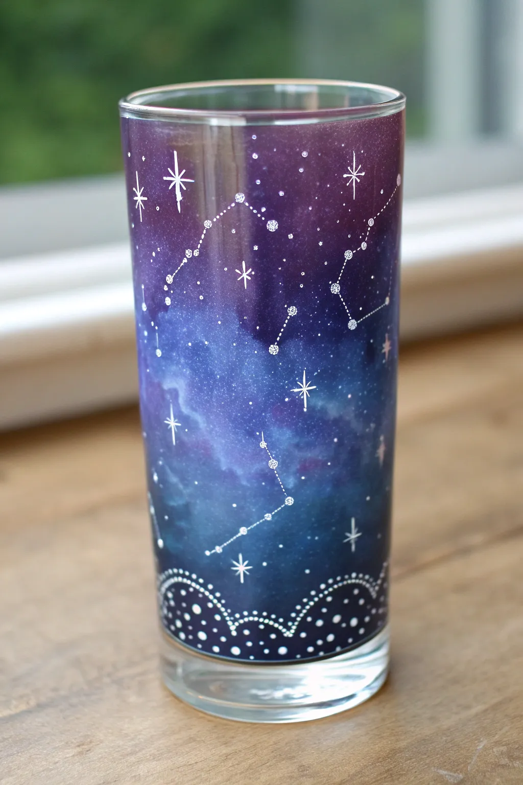 Paint a galaxy glass cup with dreamy navy-to-purple blends and tiny constellation details