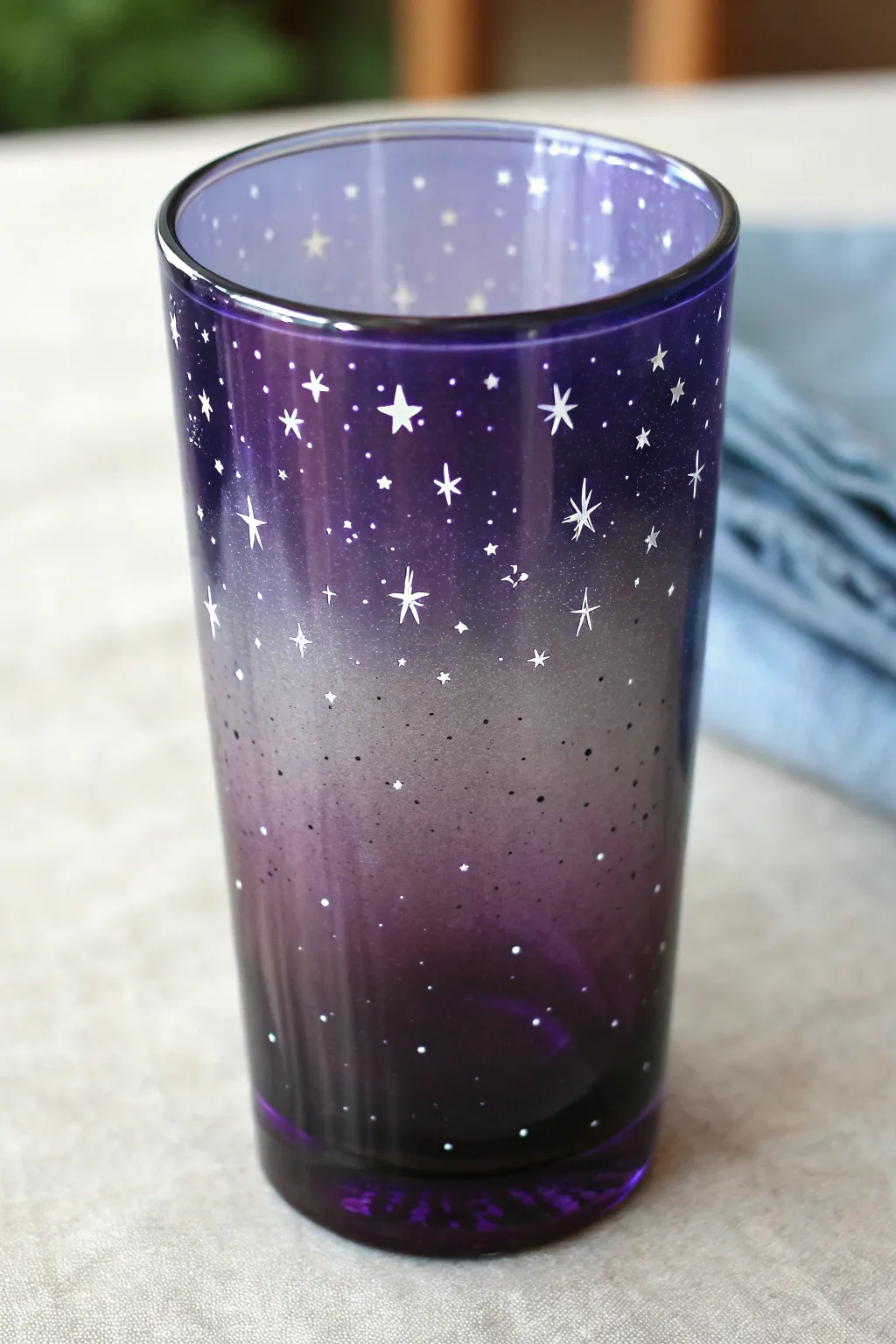 Smoky ombre night-sky glass with tiny stars for a chic, grown-up Halloween vibe