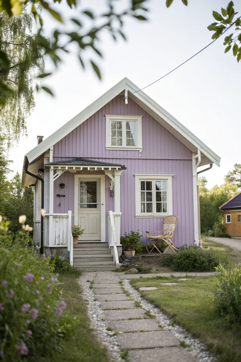 Dusty lavender cottage with cream trim, a pastel statement that pops against soft greenery.