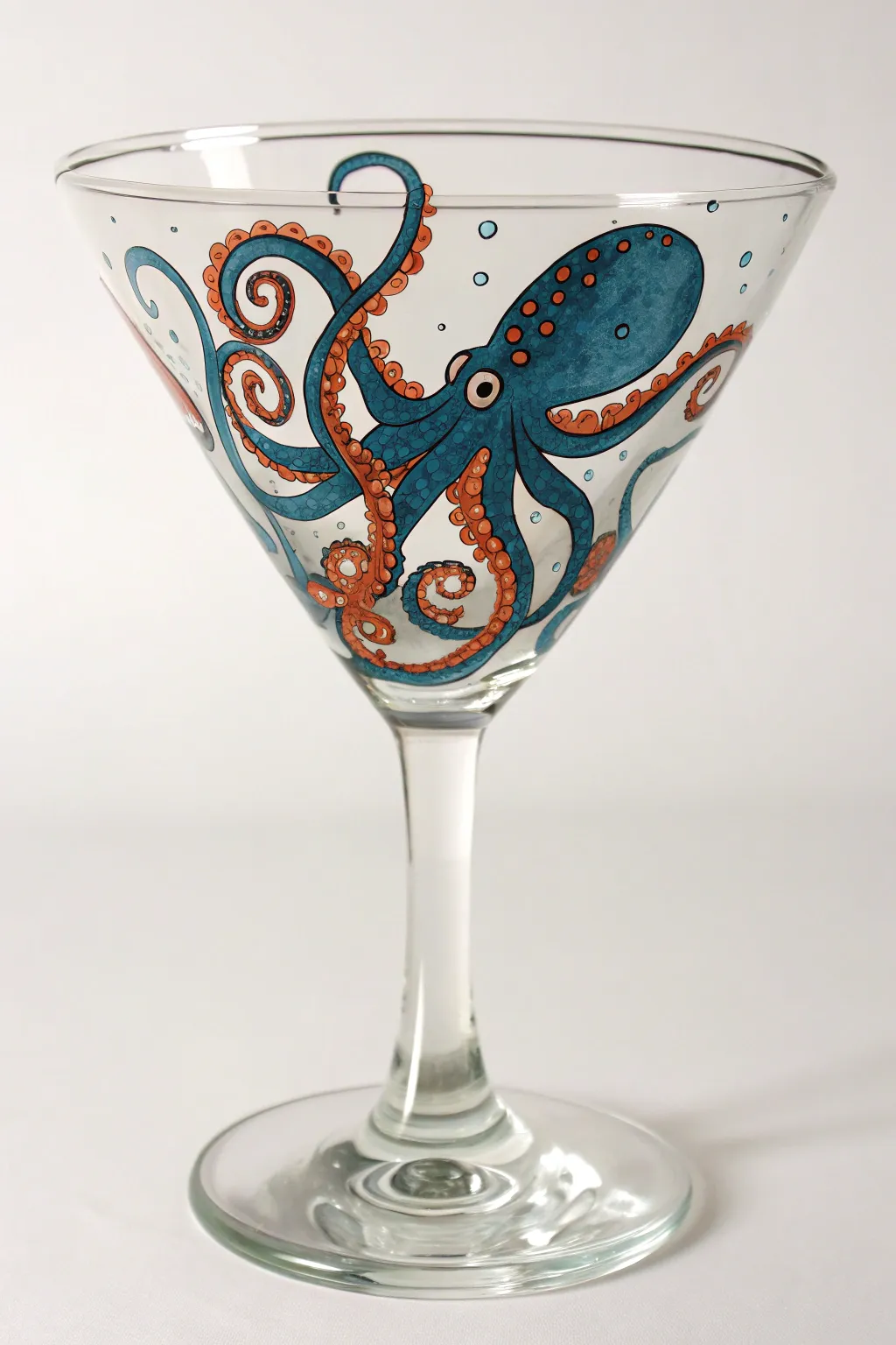 Undersea octopus tentacles wrapping the martini bowl for bold, minimalist coastal drama