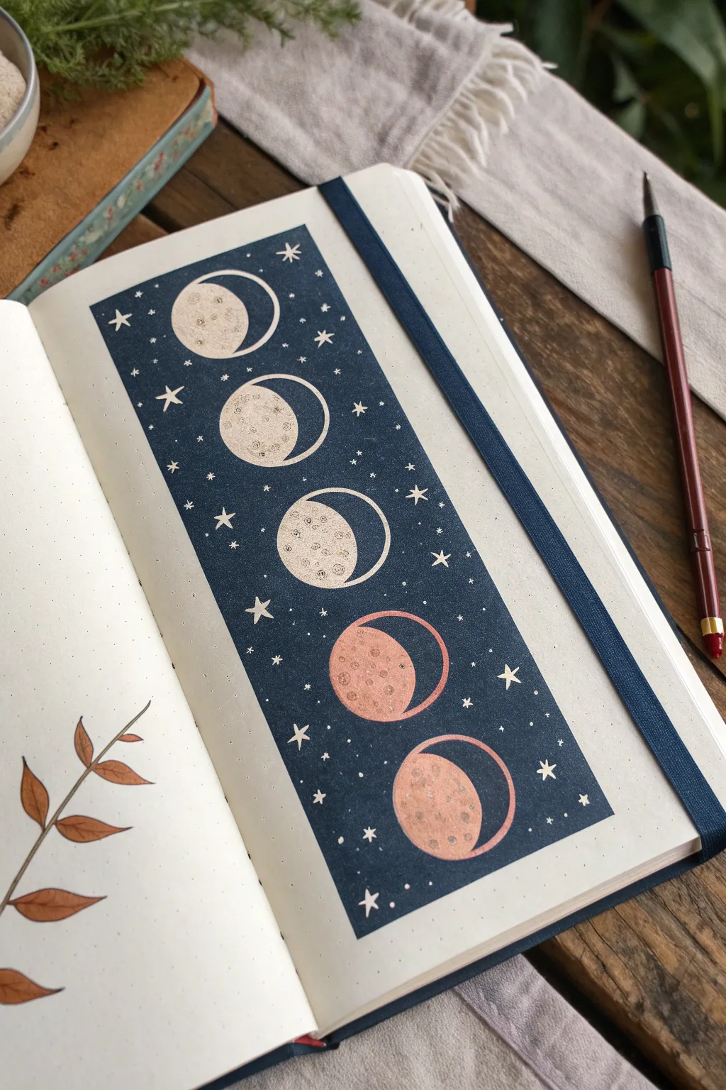 Minimal moon phase strip in a deep night sky band, a chic sketchbook drawing idea