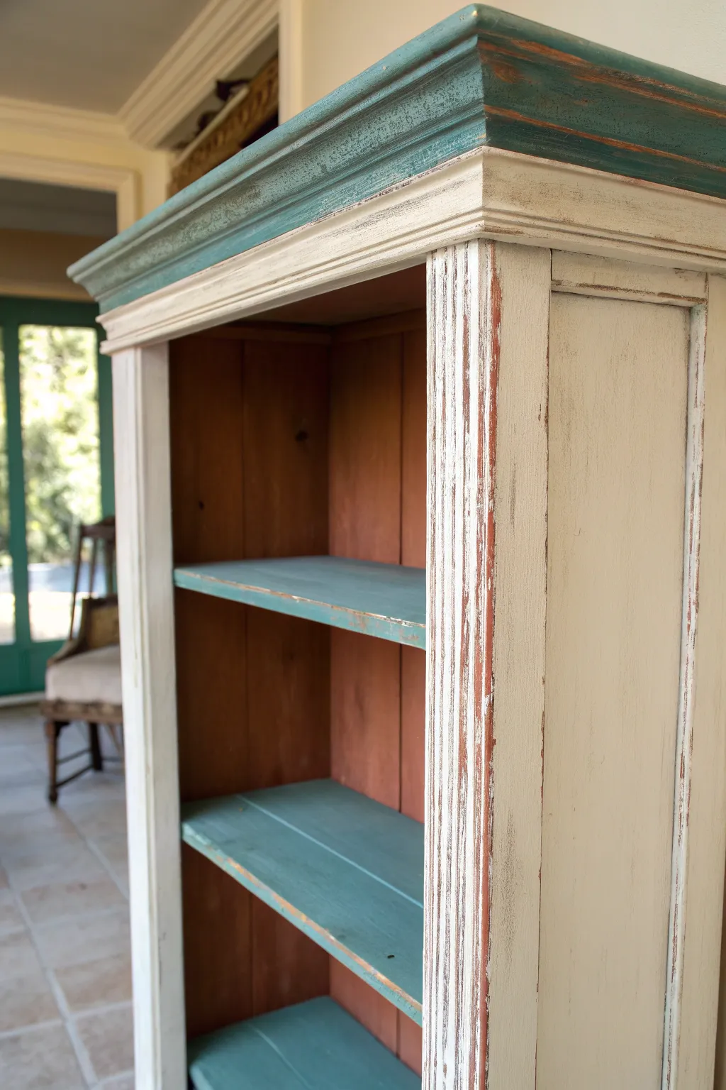 Chalky matte bookcase with softly sanded edges and layered color peeking through, vintage calm.