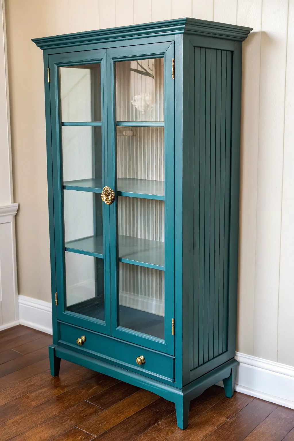 Painted curio cabinet with beadboard panels, a modern de-glassed update with boho warmth.