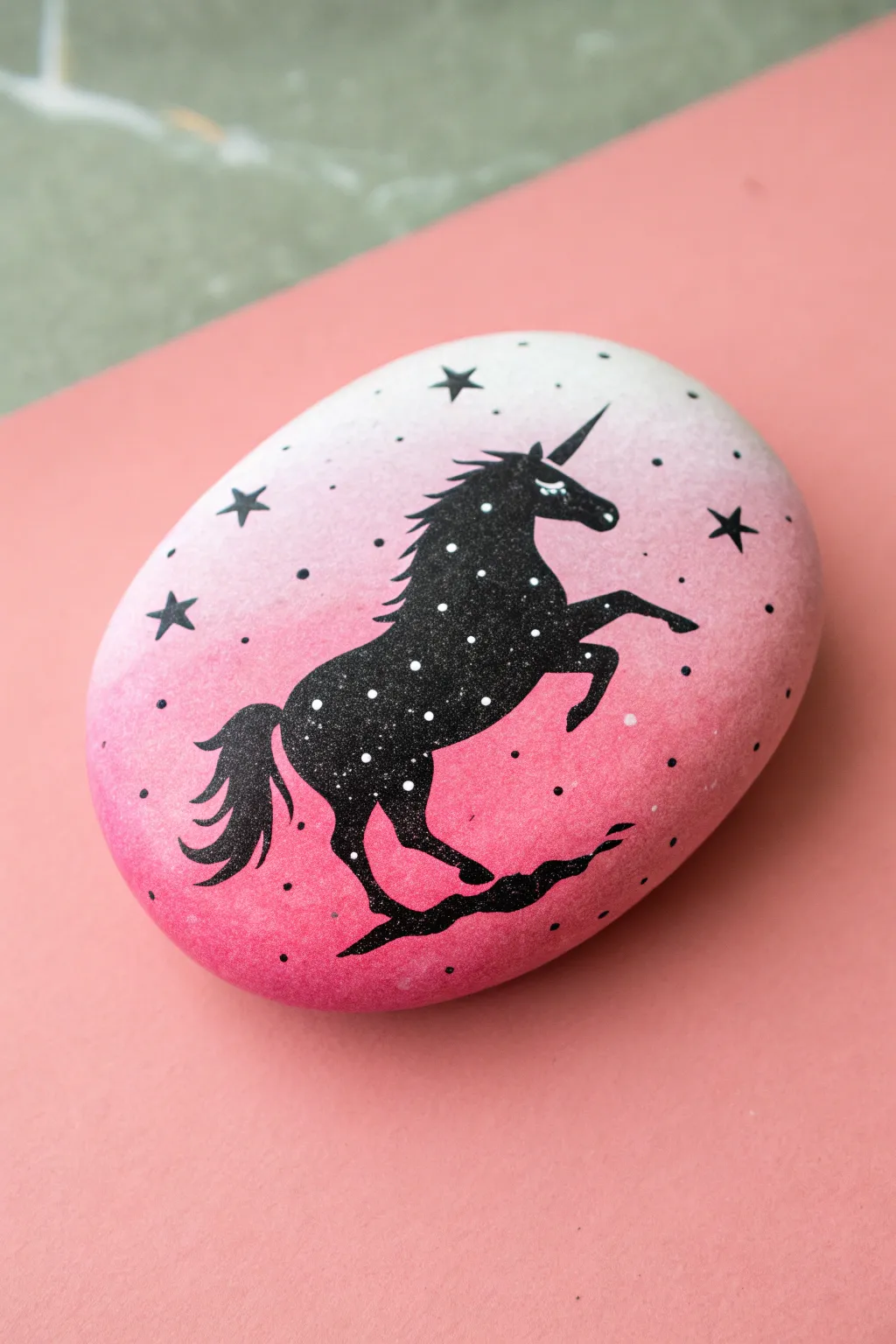 DIY inspo: pink gradient unicorn silhouette rock with starry dots, minimalist boho vibes