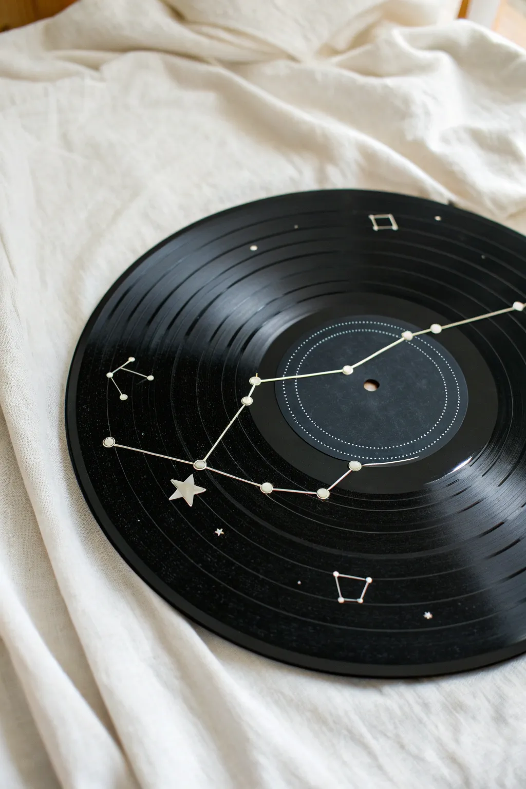 Transform old vinyls into celestial art with this minimalist zodiac DIY.