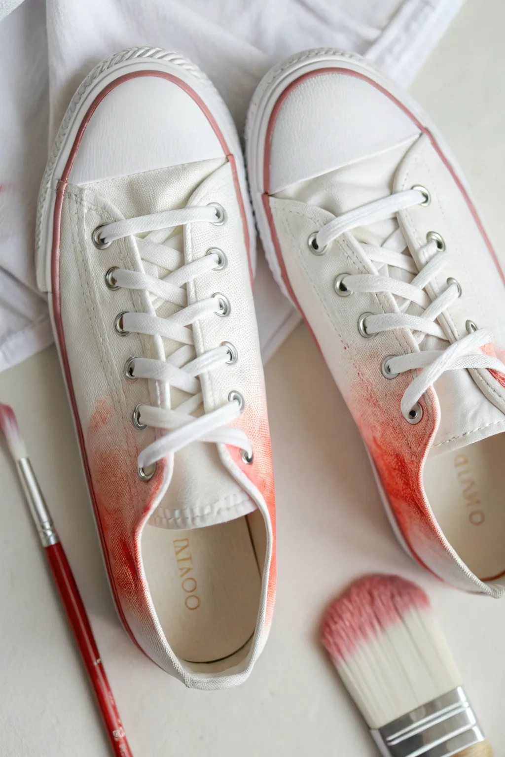 Loose watercolor ombre sneakers: bold toe color melting into crisp white for an airy finish.