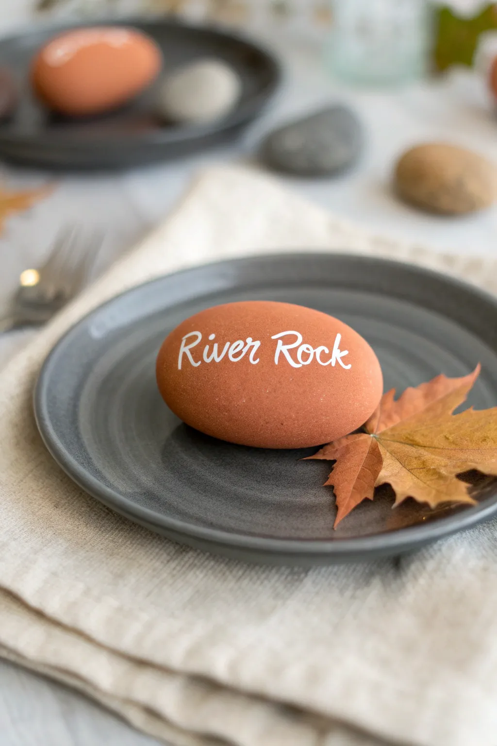 DIY family name rocks for a chic Thanksgiving place setting with minimalist Scandinavian boho style