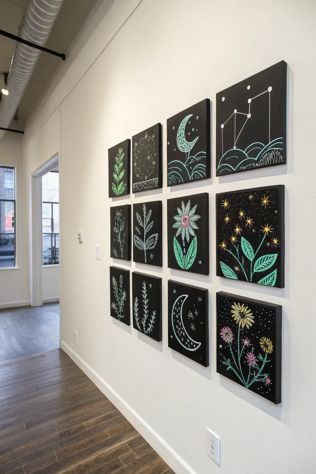 Mini UV glow canvases in a clean wall grid, each motif shining softly under black light.