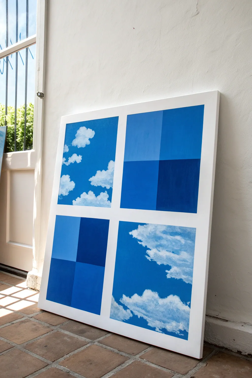 Create a bold minimal sky study: flat blues, crisp clouds, and clean poster-like shapes.