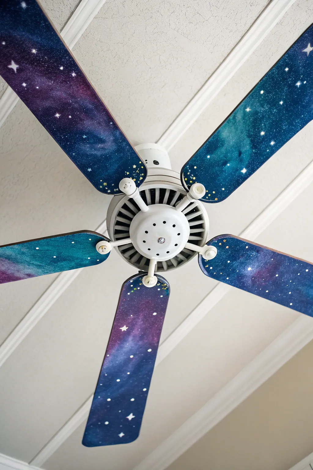 Galaxy night-sky ceiling fan blades, deep blues and star splatter for dramatic contrast