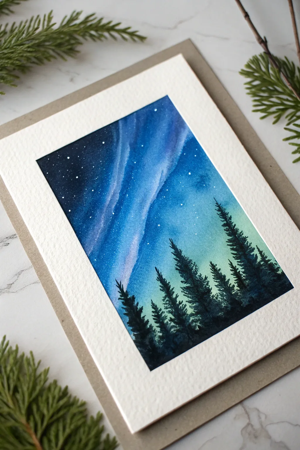 Paint soft blue aurora ribbons over a dark sky, finished with an easy silhouette tree line