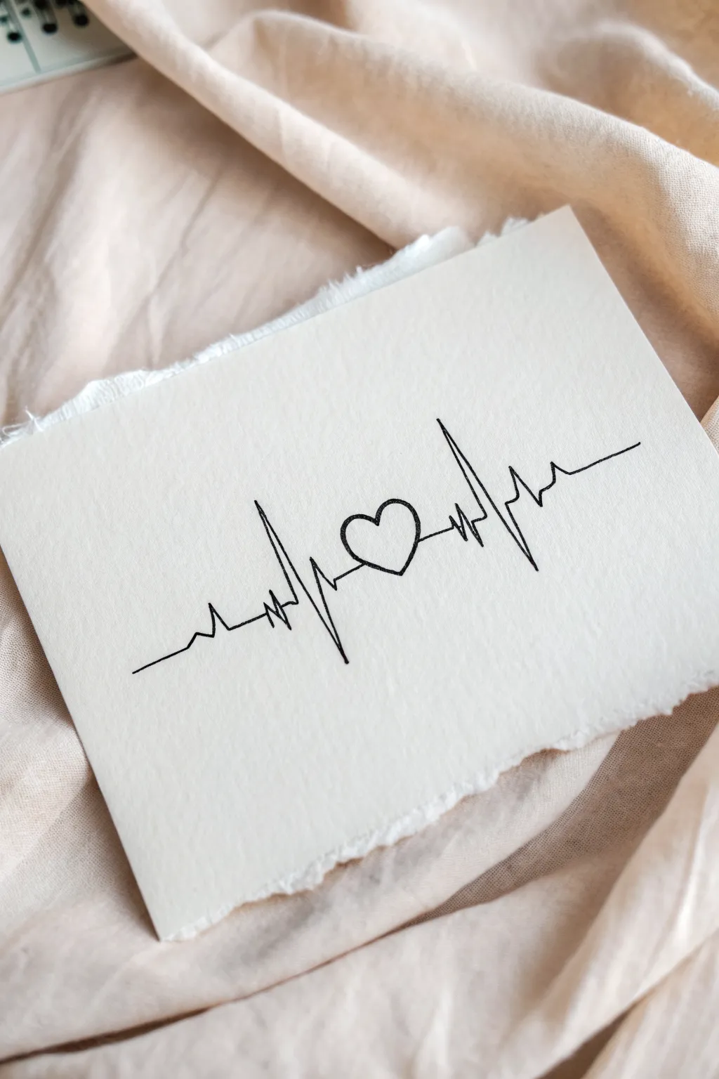 Minimal heartbeat line with a tiny heart on a soft wash background, simple and meaningful.