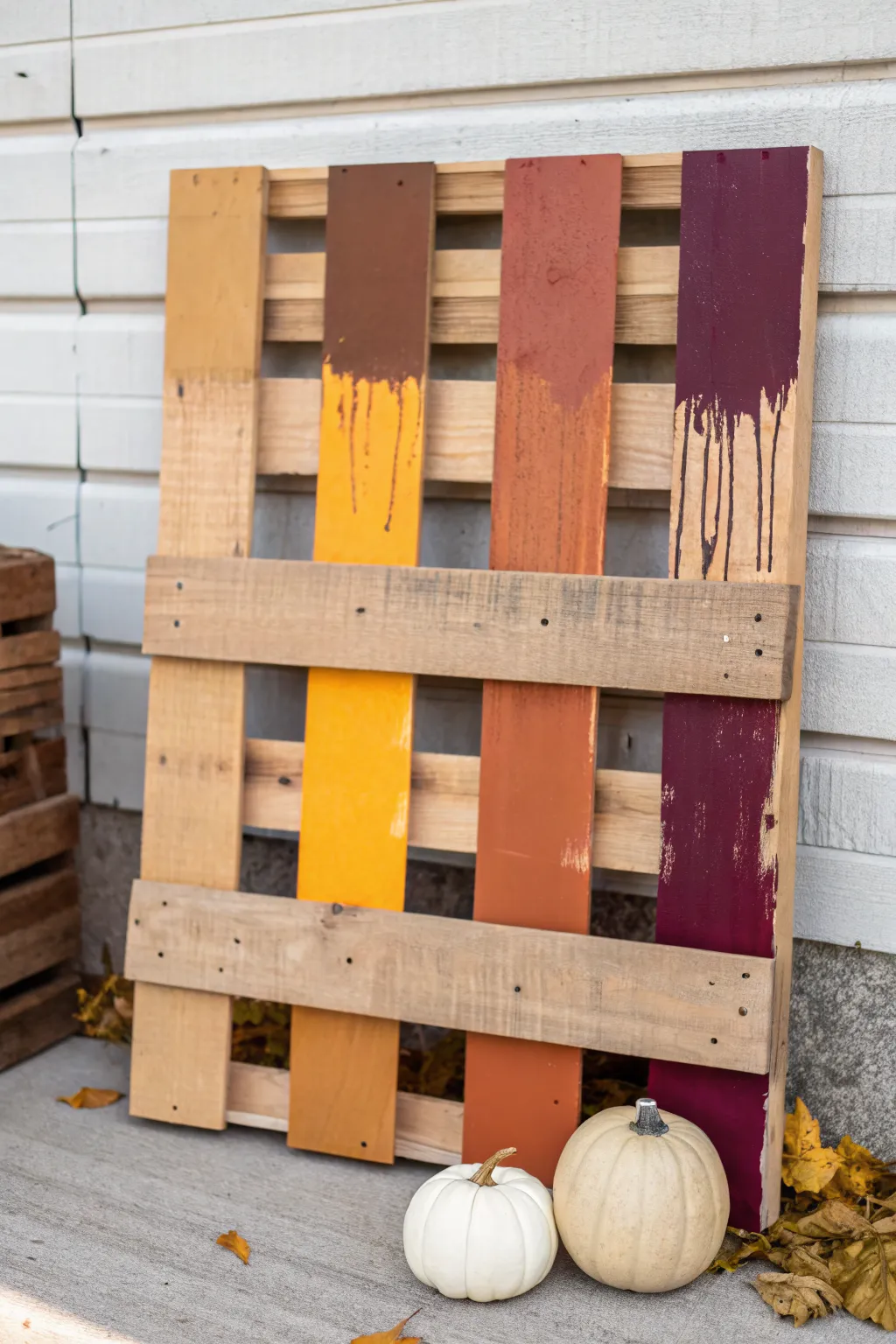 Modern fall pallet painting with bold color blocks, subtle drips, and a minimalist pumpkin