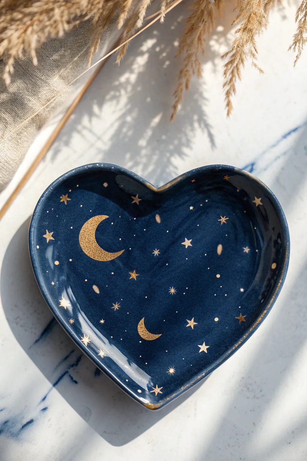 Dreamy midnight heart plate with delicate moons and stars, a minimalist boho painting idea