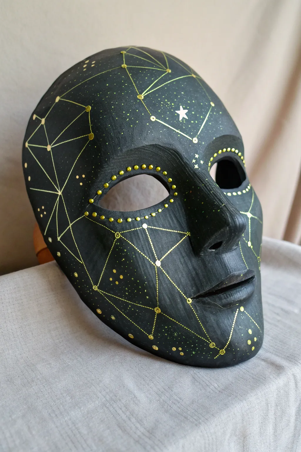 Neon UV lines and dots turn a matte black mask into a glowing minimalist rave statement
