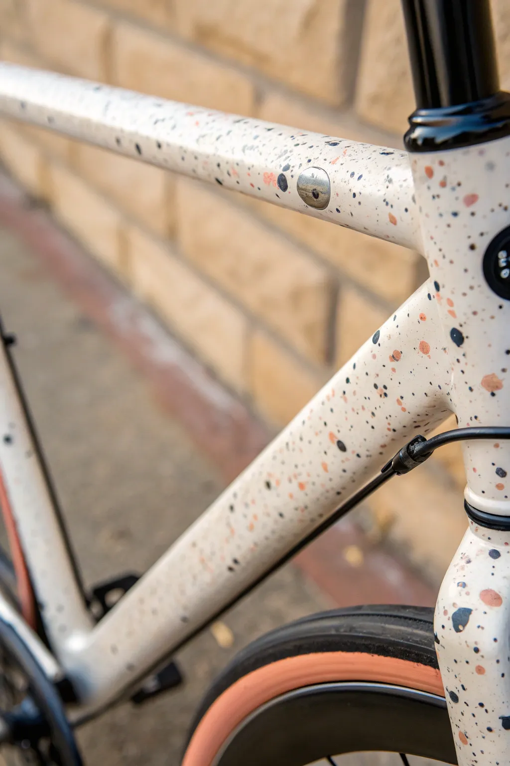 Matte base coat with terracotta and charcoal confetti speckles for a modern bike paint look