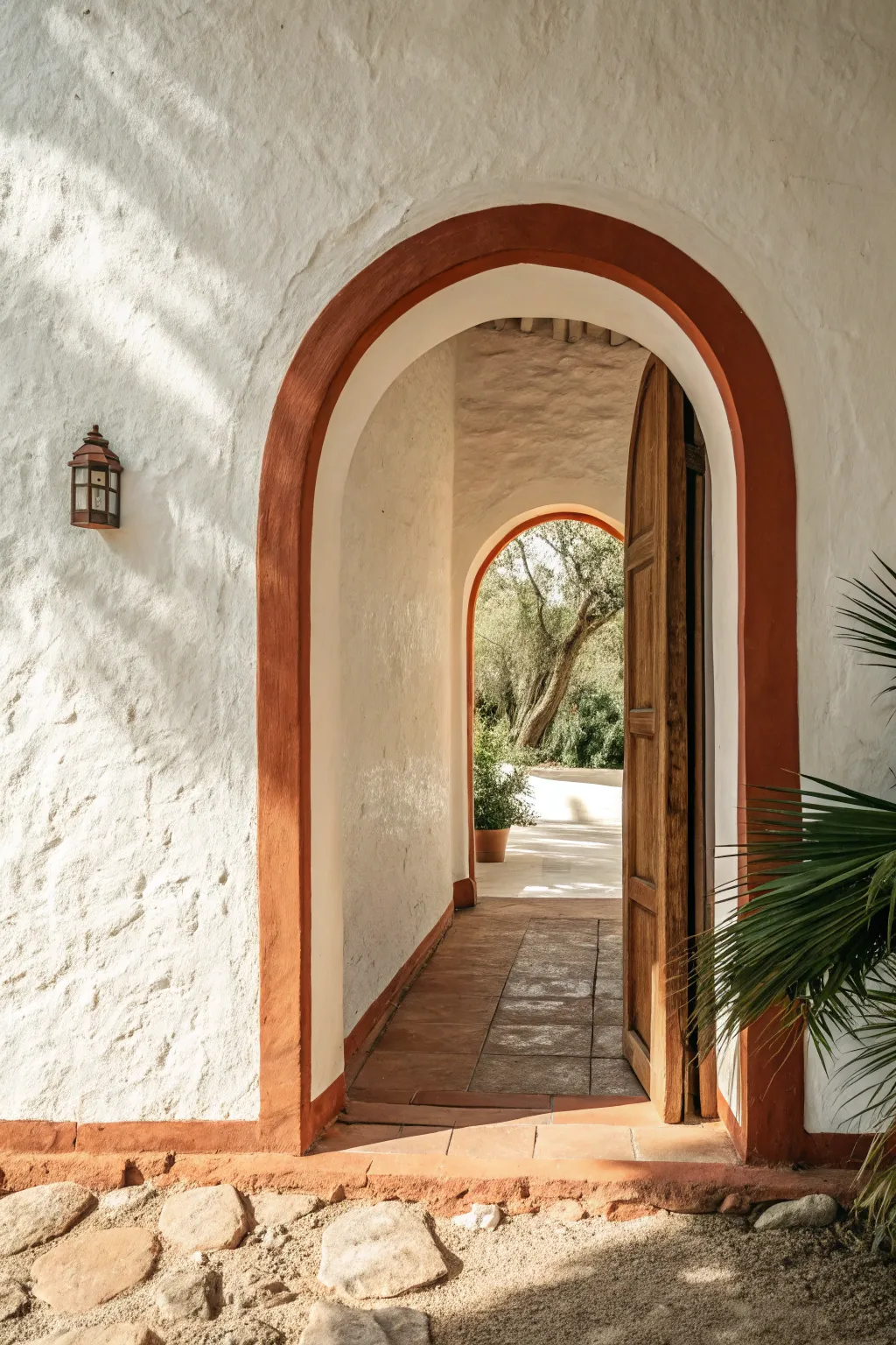 Arched opening with a crisp painted border in earthy contrast for a minimal boho wall detail